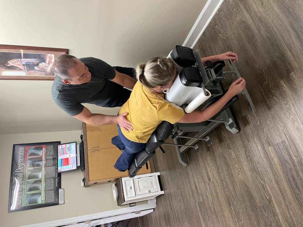 Dr. Scot Thompson adjusting a patient at Thompson Chiropractic & Wellness in Dothan, AL
